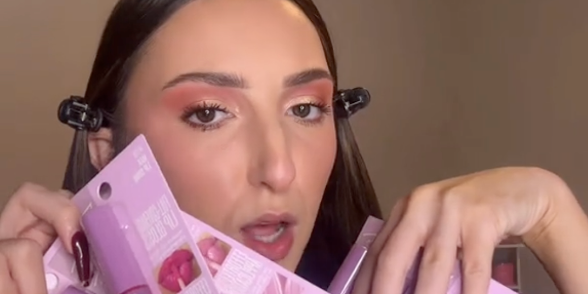 beauty influencer alexis simone holding up new lipsticks from dollar tree Dollar Tree Has 6 New Beauty Items for $1.25—Here's What a Makeup Expert Really Thinks About Them